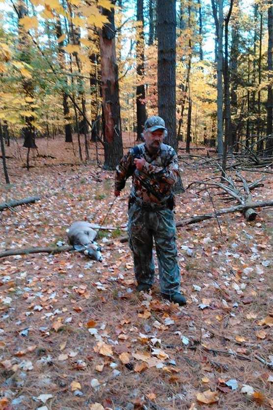 Ron "Cubby Buttons" Nadler of Corinth drags out a doe he shot on Oct. 17 near Lake George during the early muzzleloading season.