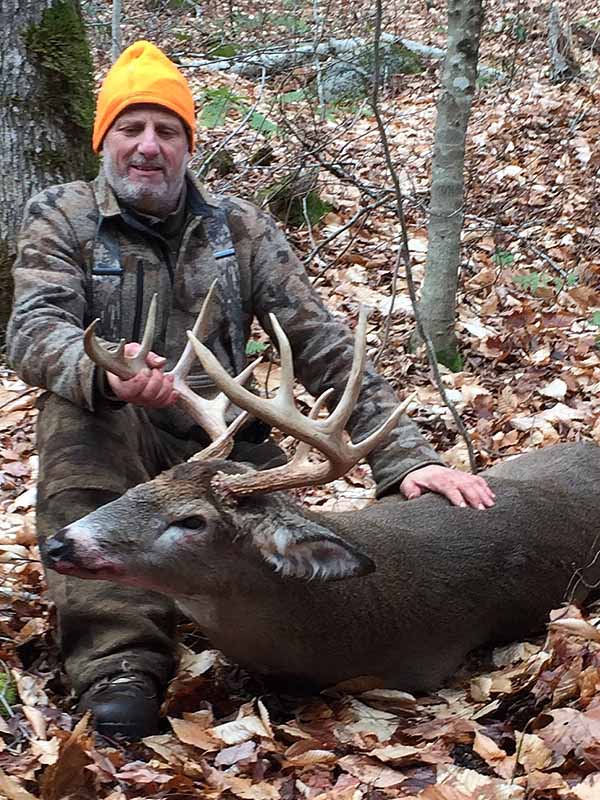 Mike Julian of Waterford, NY with a 175-pound, 11-pointer tank Nov. 11 in Schroon Lake, Essex County
